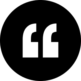 Black circle with white quotation marks inside.