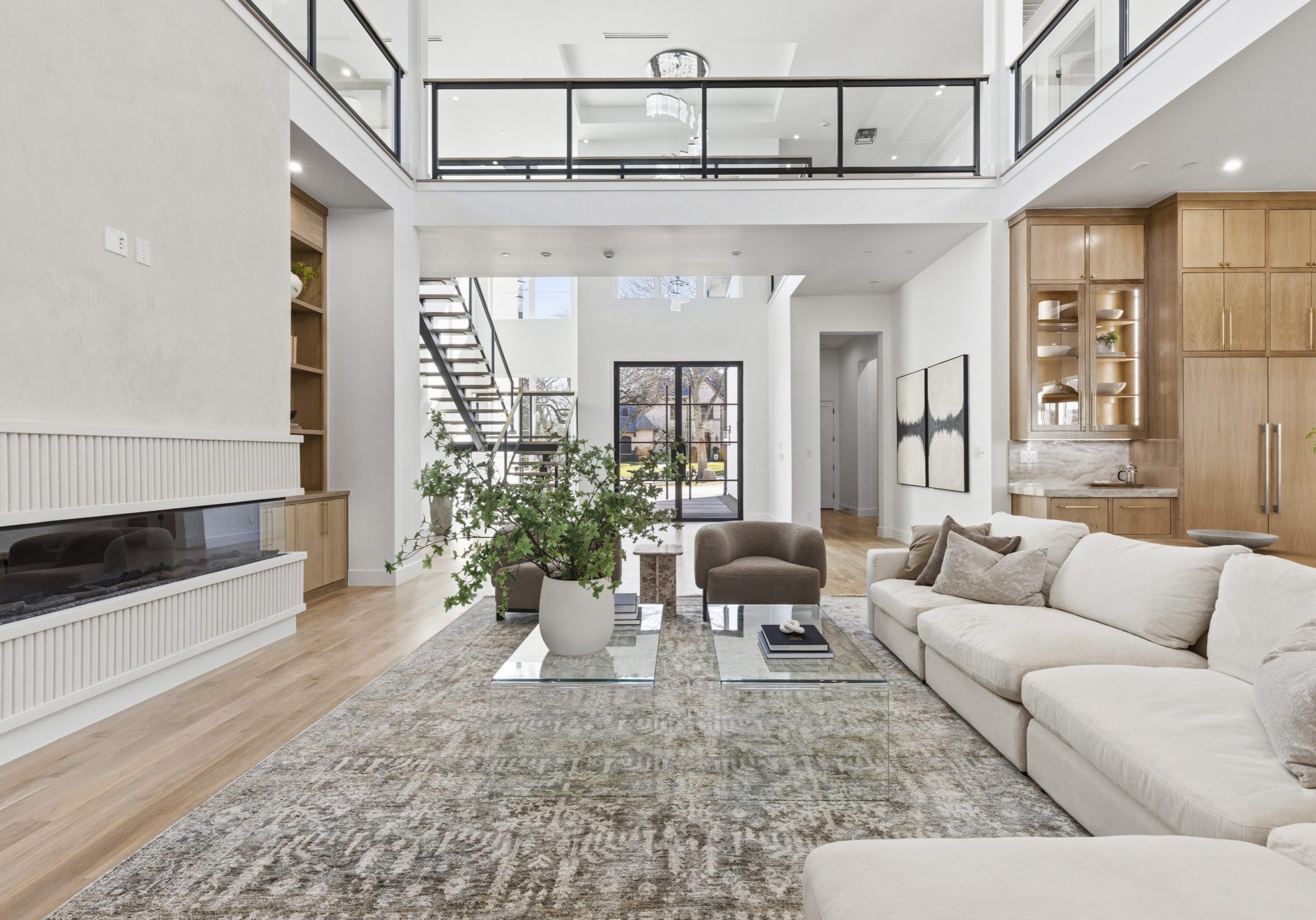 Spacious modern living room with high ceilings and natural light.